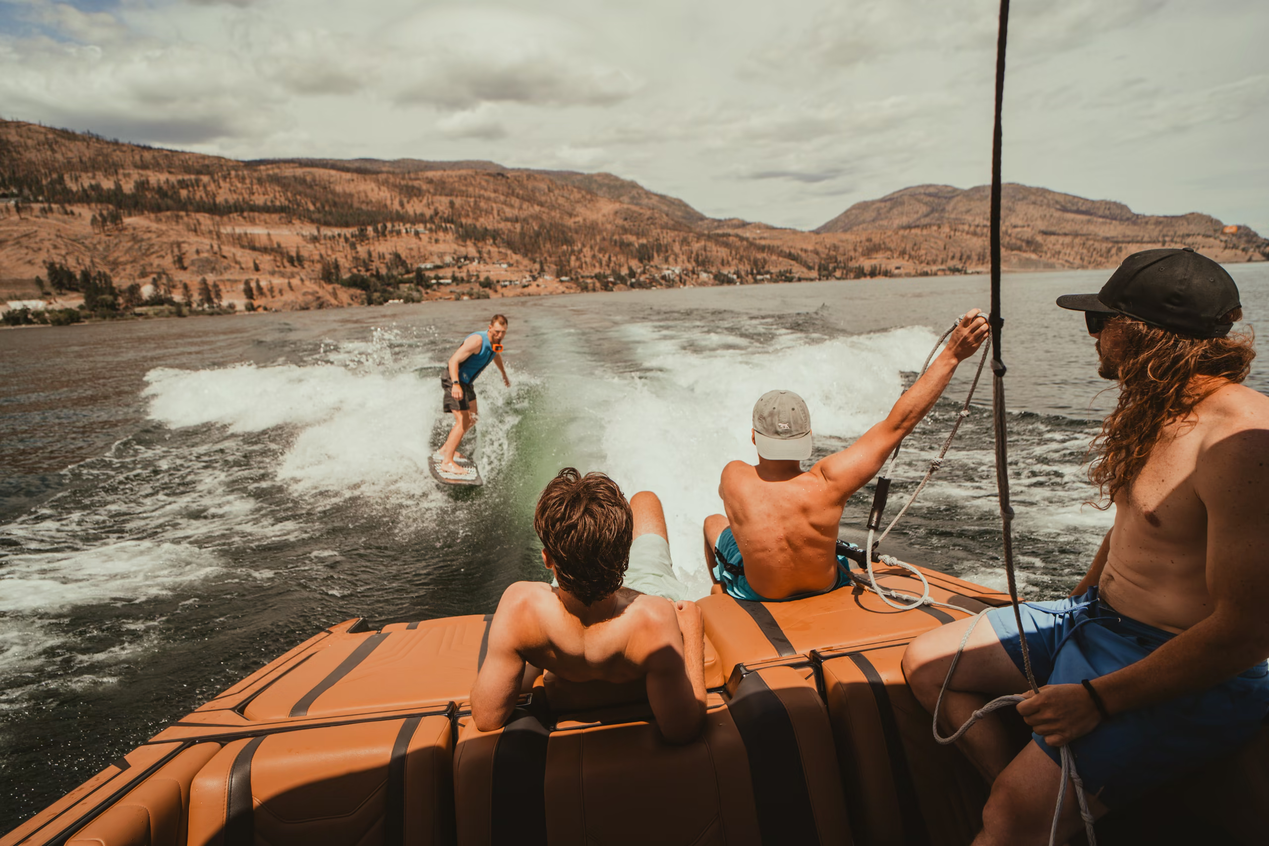 Wakesurfer and crew below burnt hills
